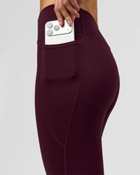 Woman wearing Fusion High-Rise 7/8 Legging Pockets - Cherry Lacquer | Model:Taneisha | Size:XS | Thumbnail Index: 4
