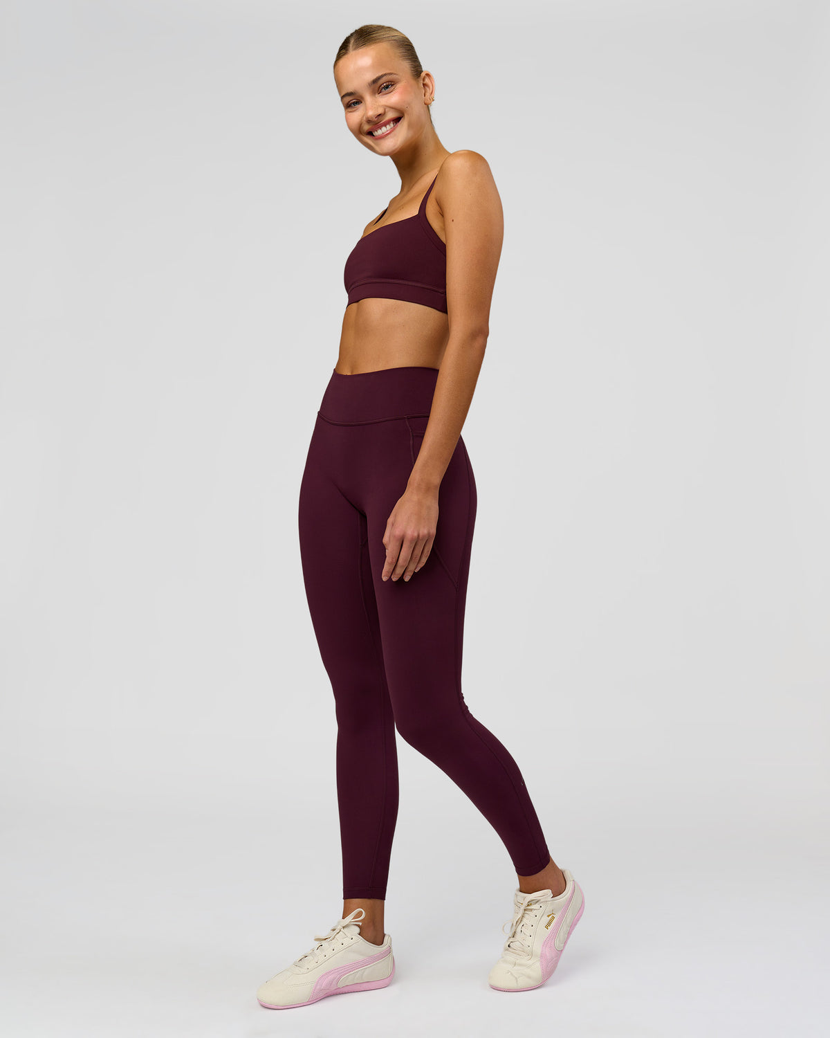 Woman wearing Fusion High-Rise Full Length Legging Pockets - Cherry Lacquer | Model:Taneisha | Size:XS