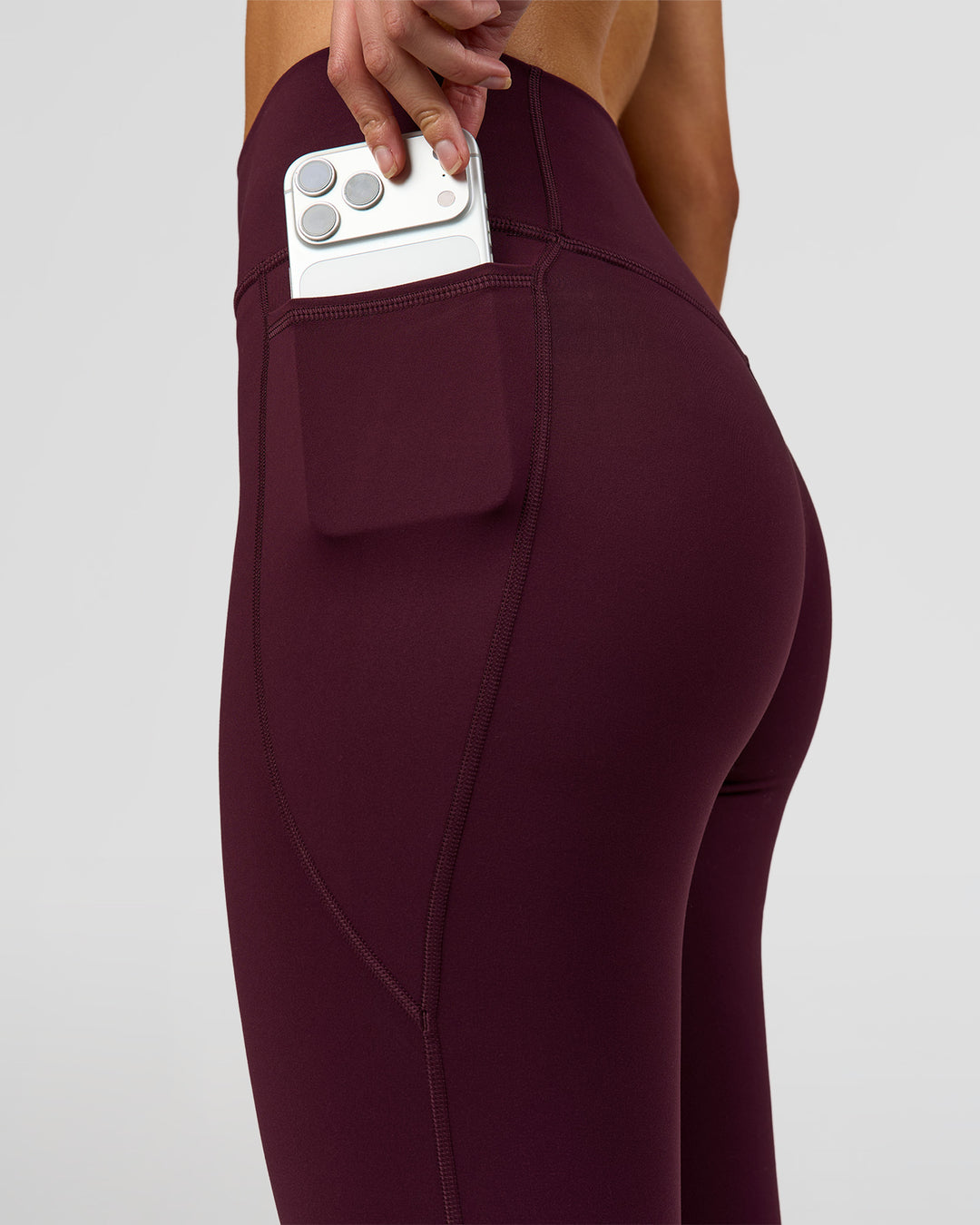 Woman wearing Fusion High-Rise Full Length Legging Pockets - Cherry Lacquer | Model:Taneisha | Size:XS - view 5