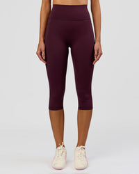 Woman wearing Fusion Ultra High-Rise 3/4 Legging Pockets - Cherry Lacquer | Model:Taneisha | Size:XS | Thumbnail Index: 0