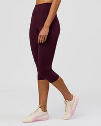 Woman wearing Fusion Ultra High-Rise 3/4 Legging Pockets - Cherry Lacquer | Model:Taneisha | Size:XS | Thumbnail Index: 1