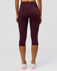 Woman wearing Fusion Ultra High-Rise 3/4 Legging Pockets - Cherry Lacquer | Model:Taneisha | Size:XS | Thumbnail Index: 5