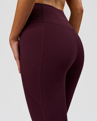 Woman wearing Fusion Ultra High-Rise 3/4 Legging Pockets - Cherry Lacquer | Model:Taneisha | Size:XS | Thumbnail Index: 7