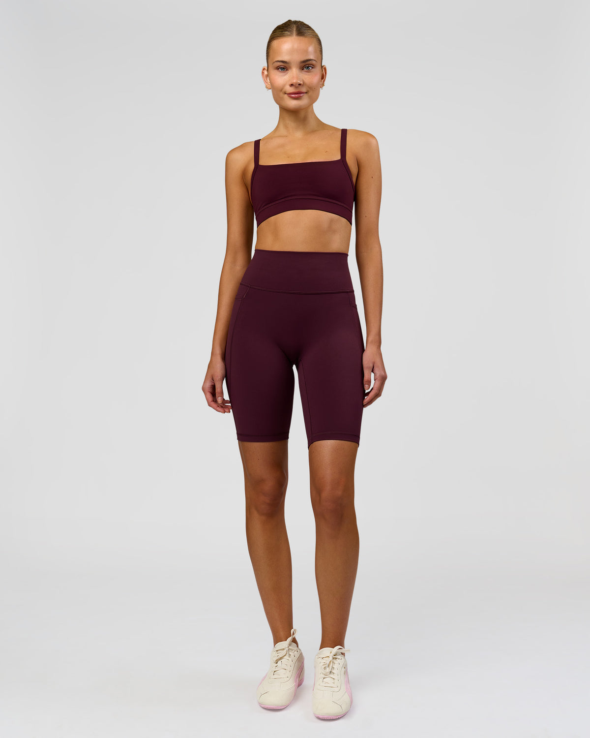 Woman wearing Fusion Ultra High-Rise 9" Short Pockets - Cherry Lacquer | Model:Taneisha | Size:XS