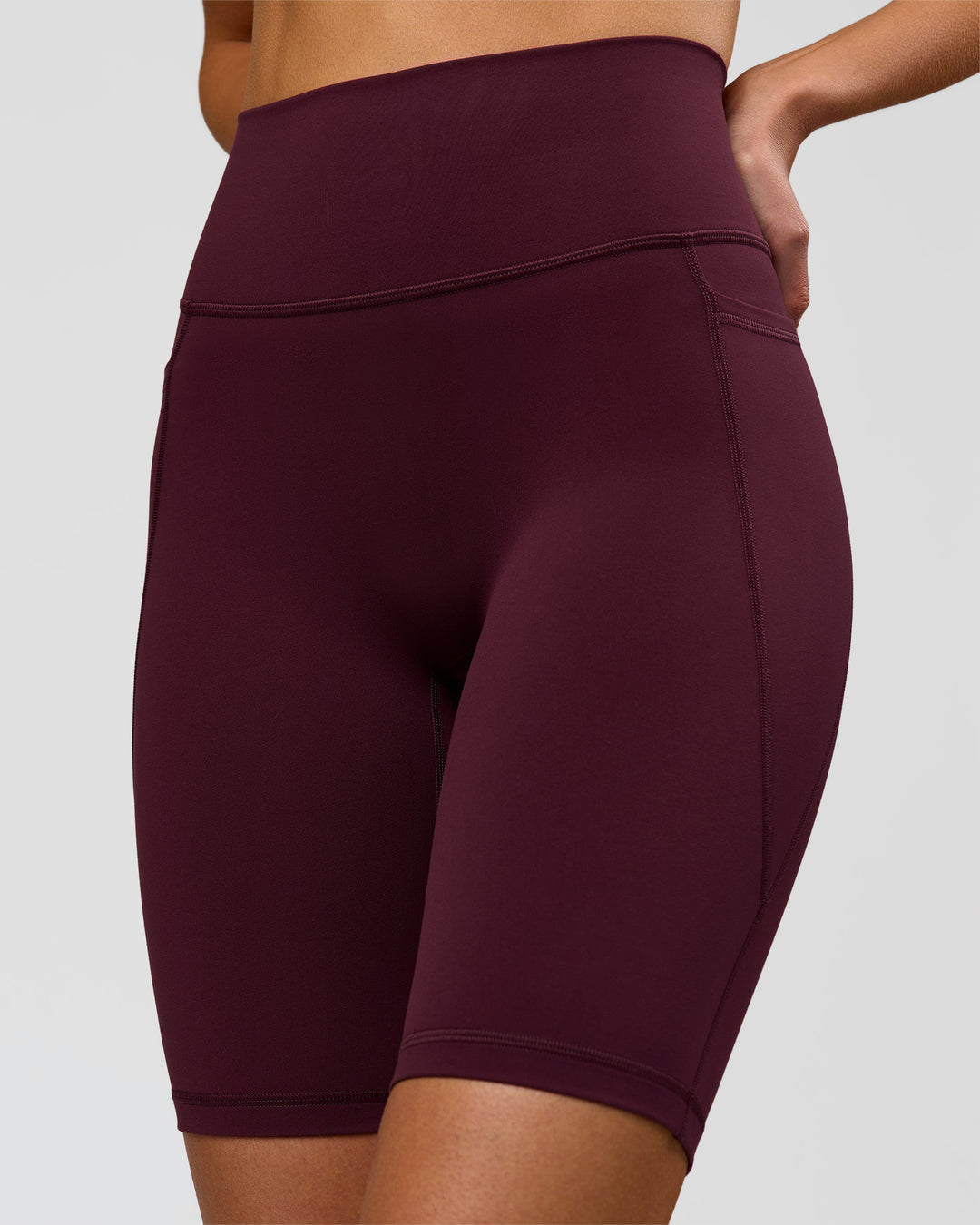 Woman wearing Fusion Ultra High-Rise 9" Short Pockets - Cherry Lacquer | Model:Taneisha | Size:XS - view 3