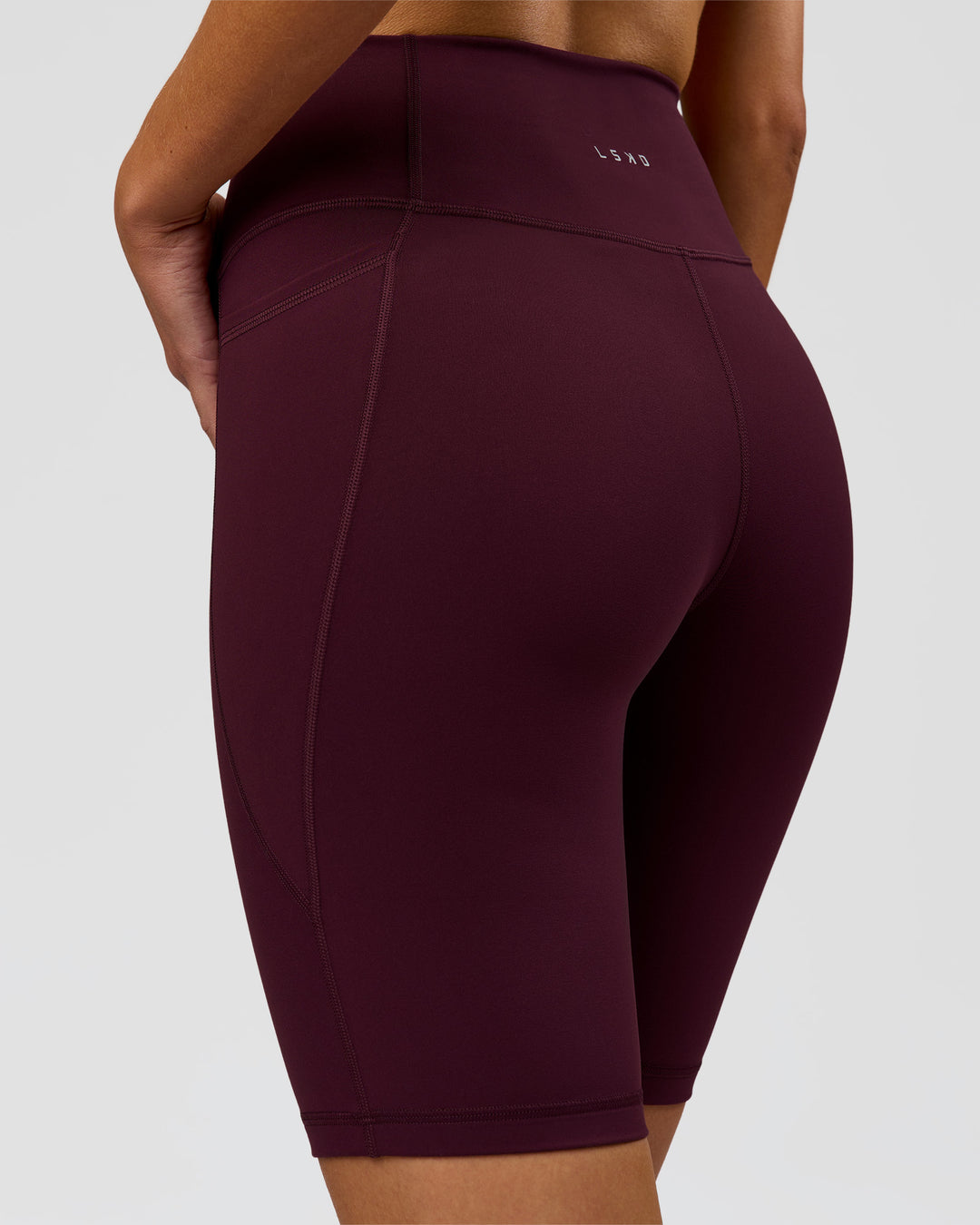 Woman wearing Fusion Ultra High-Rise 9" Short Pockets - Cherry Lacquer | Model:Taneisha | Size:XS - view 5