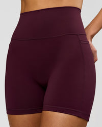 Woman wearing Fusion V-Contour Ultra High-Rise 4" Short Pockets - Cherry Lacquer | Model:Taneisha | Size:XS | Thumbnail Index: 1