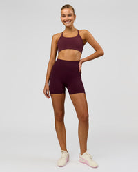 Woman wearing Fusion V-Contour Ultra High-Rise 4" Short Pockets - Cherry Lacquer | Model:Taneisha | Size:XS | Thumbnail Index: 4