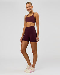 Woman wearing Fusion V-Contour Ultra High-Rise 4" Short Pockets - Cherry Lacquer | Model:Taneisha | Size:XS | Thumbnail Index: 5
