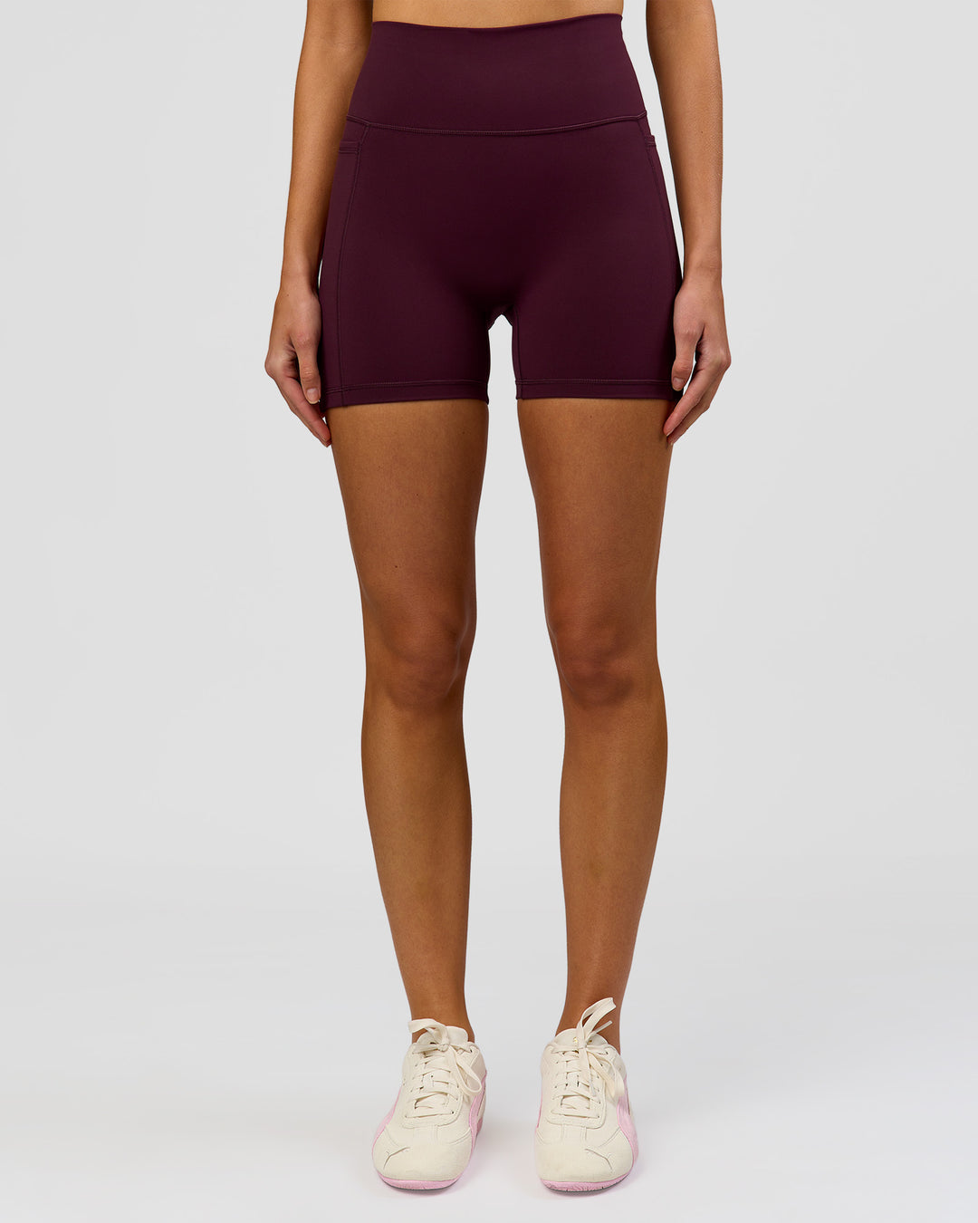 Woman wearing Fusion V-Contour Ultra High-Rise 4" Short Pockets - Cherry Lacquer | Model:Taneisha | Size:XS - view 7