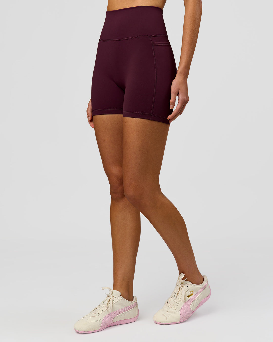Woman wearing Fusion V-Contour Ultra High-Rise 4" Short Pockets - Cherry Lacquer | Model:Taneisha | Size:XS - view 8
