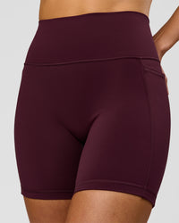 Woman wearing Fusion V-Contour Ultra High-Rise 6" Short Pockets - Cherry Lacquer | Model:Taneisha | Size:XS | Thumbnail Index: 0