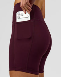 Woman wearing Fusion V-Contour Ultra High-Rise 6" Short Pockets - Cherry Lacquer | Model:Taneisha | Size:XS | Thumbnail Index: 3