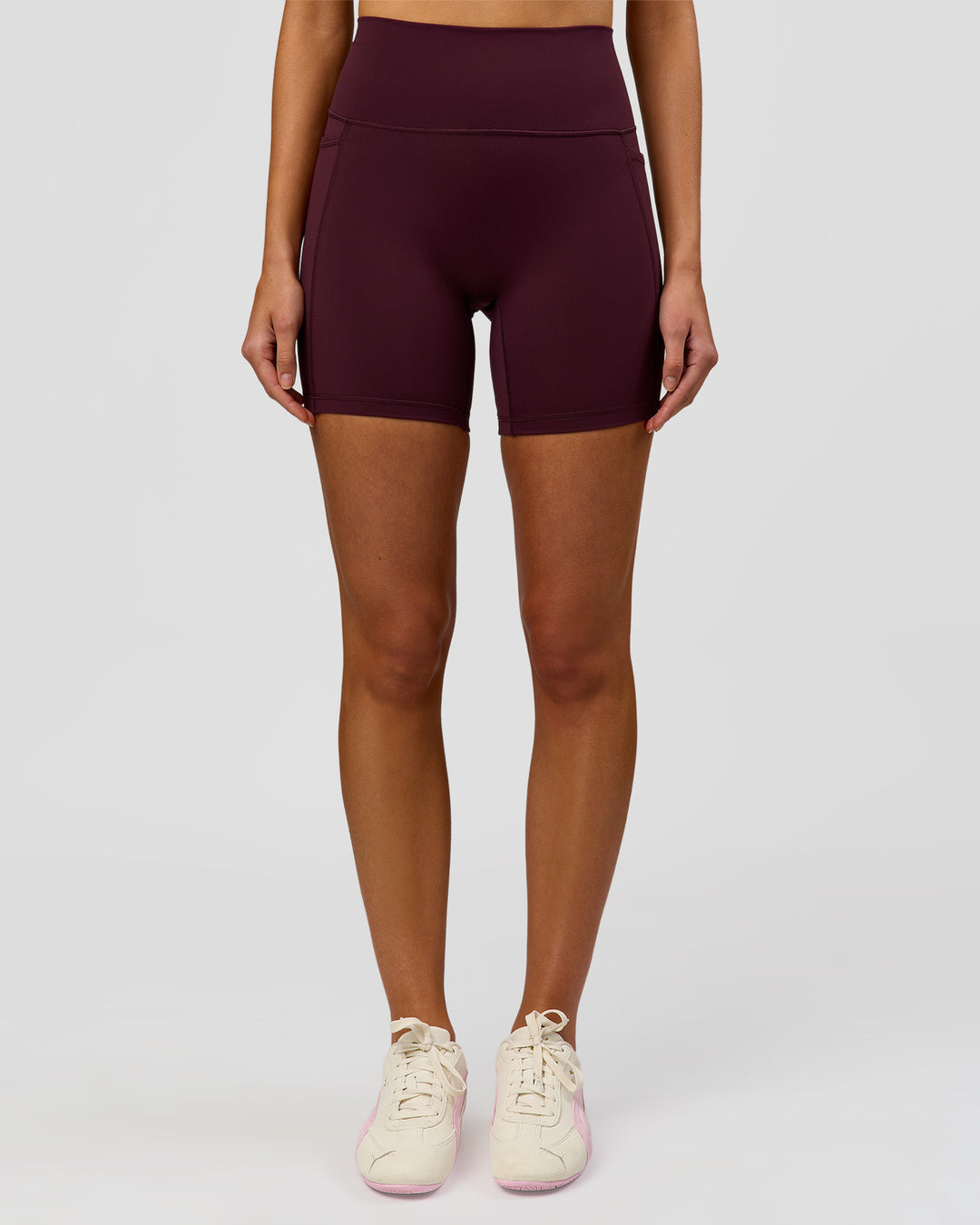 Woman wearing Fusion V-Contour Ultra High-Rise 6" Short Pockets - Cherry Lacquer | Model:Taneisha | Size:XS - view 5