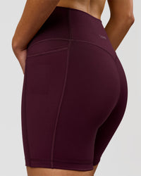 Woman wearing Fusion V-Contour Ultra High-Rise 6" Short Pockets - Cherry Lacquer | Model:Taneisha | Size:XS | Thumbnail Index: 6
