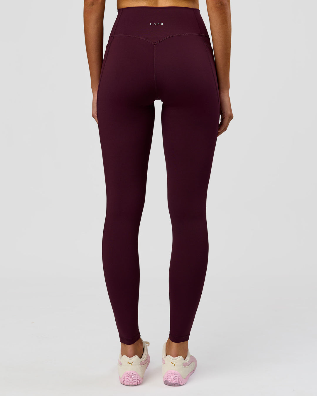 Woman wearing Fusion V-Contour Ultra High-Rise Full Length Legging Pockets - Cherry Lacquer | Model:Taneisha | Size:XS - view 2