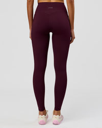 Woman wearing Fusion V-Contour Ultra High-Rise Full Length Legging Pockets - Cherry Lacquer | Model:Taneisha | Size:XS | Thumbnail Index: 1
