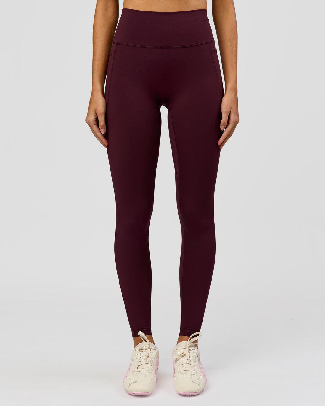 Woman wearing Fusion V-Contour Ultra High-Rise Full Length Legging Pockets - Cherry Lacquer | Model:Taneisha | Size:XS - view 1