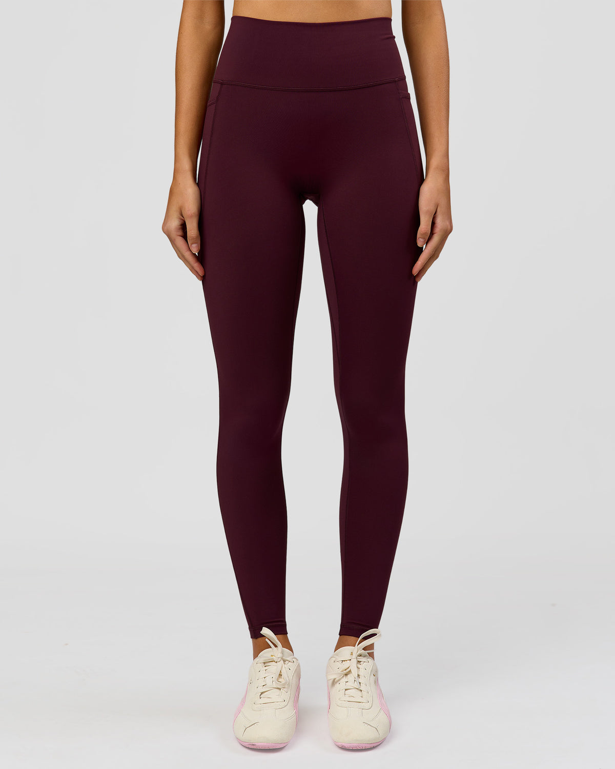Woman wearing Fusion V-Contour Ultra High-Rise Full Length Legging Pockets - Cherry Lacquer | Model:Taneisha | Size:XS