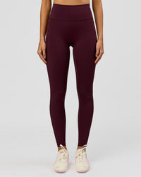 Woman wearing Fusion V-Contour Ultra High-Rise Full Length Legging Pockets - Cherry Lacquer | Model:Taneisha | Size:XS | Thumbnail Index: 0