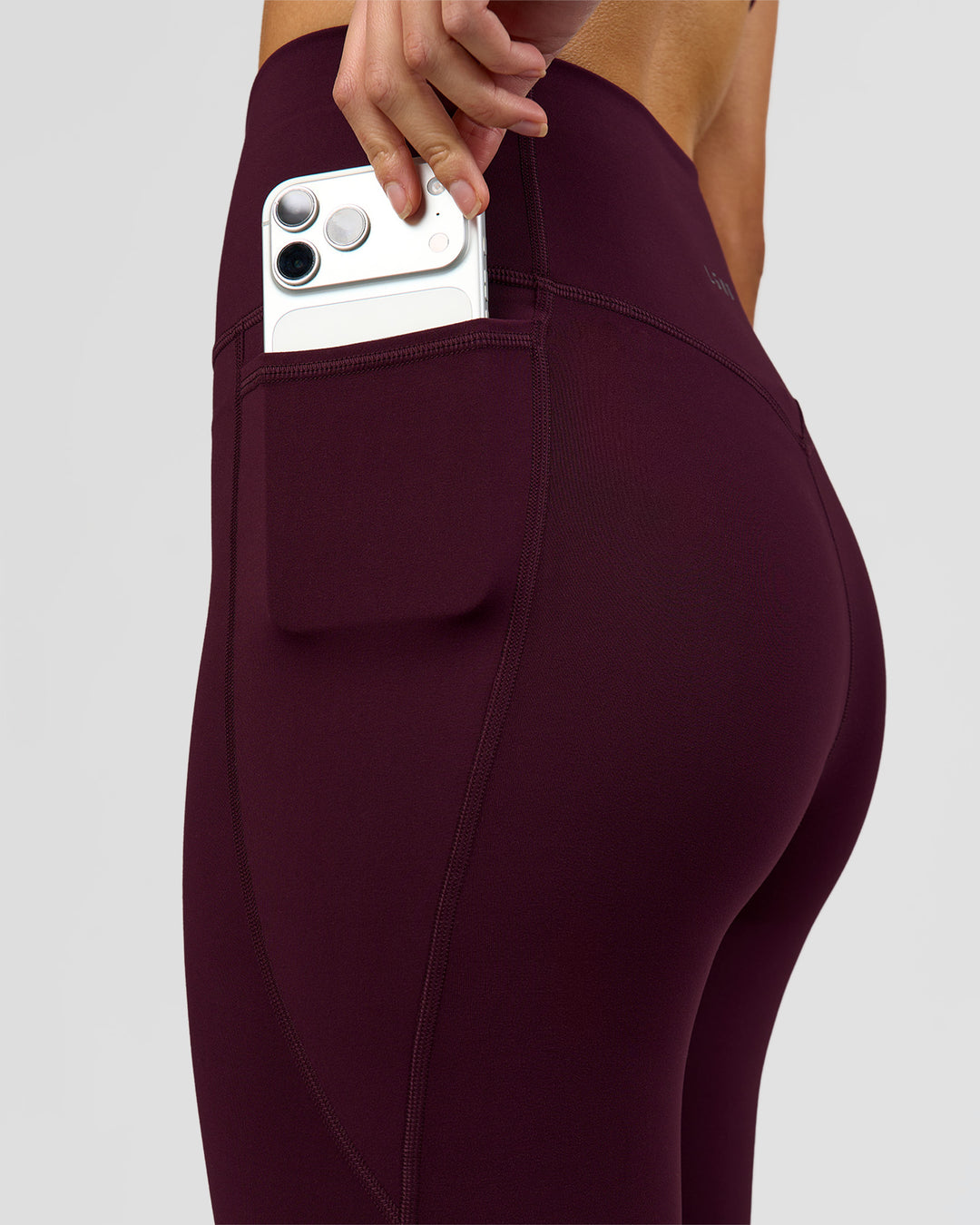 Woman wearing Fusion V-Contour Ultra High-Rise Full Length Legging Pockets - Cherry Lacquer | Model:Taneisha | Size:XS - view 7
