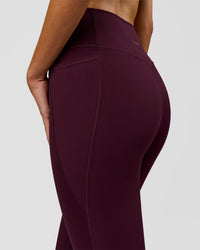 Woman wearing Fusion V-Contour Ultra High-Rise Full Length Legging Pockets - Cherry Lacquer | Model:Taneisha | Size:XS | Thumbnail Index: 7