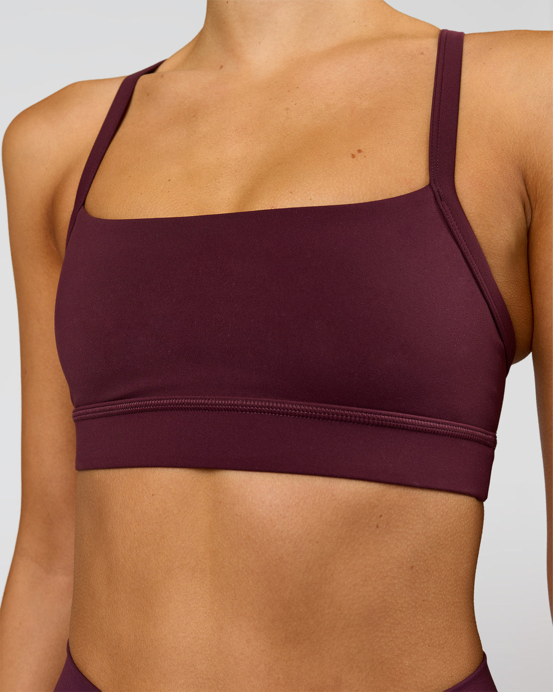 Woman wearing Momentum Sports Bra - Cherry Lacquer | Model:Taneisha | Size:XS - view 9