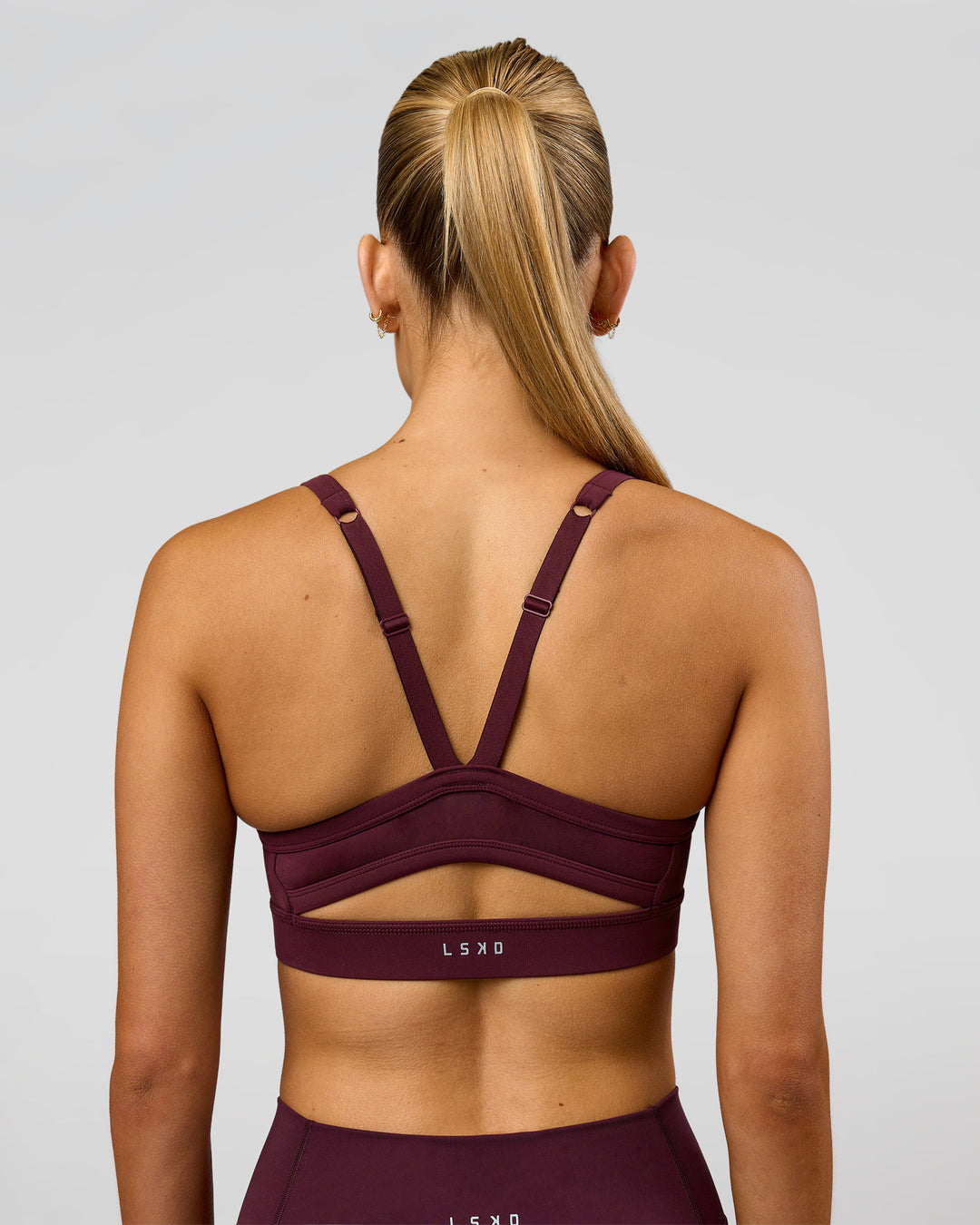 Woman wearing Momentum Sports Bra - Cherry Lacquer | Model:Taneisha | Size:XS - view 5