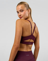 Woman wearing Momentum Sports Bra - Cherry Lacquer | Model:Taneisha | Size:XS | Thumbnail Index: 7
