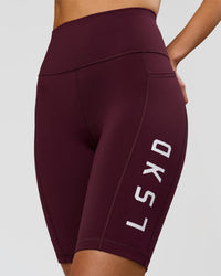 Woman wearing Rep Ultra High-Rise 9" Short Pockets - Cherry Lacquer-White | Model:Taneisha | Size:XS | Thumbnail Index: 1