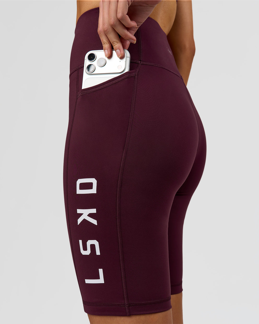 Woman wearing Rep Ultra High-Rise 9" Short Pockets - Cherry Lacquer-White | Model:Taneisha | Size:XS - view 6