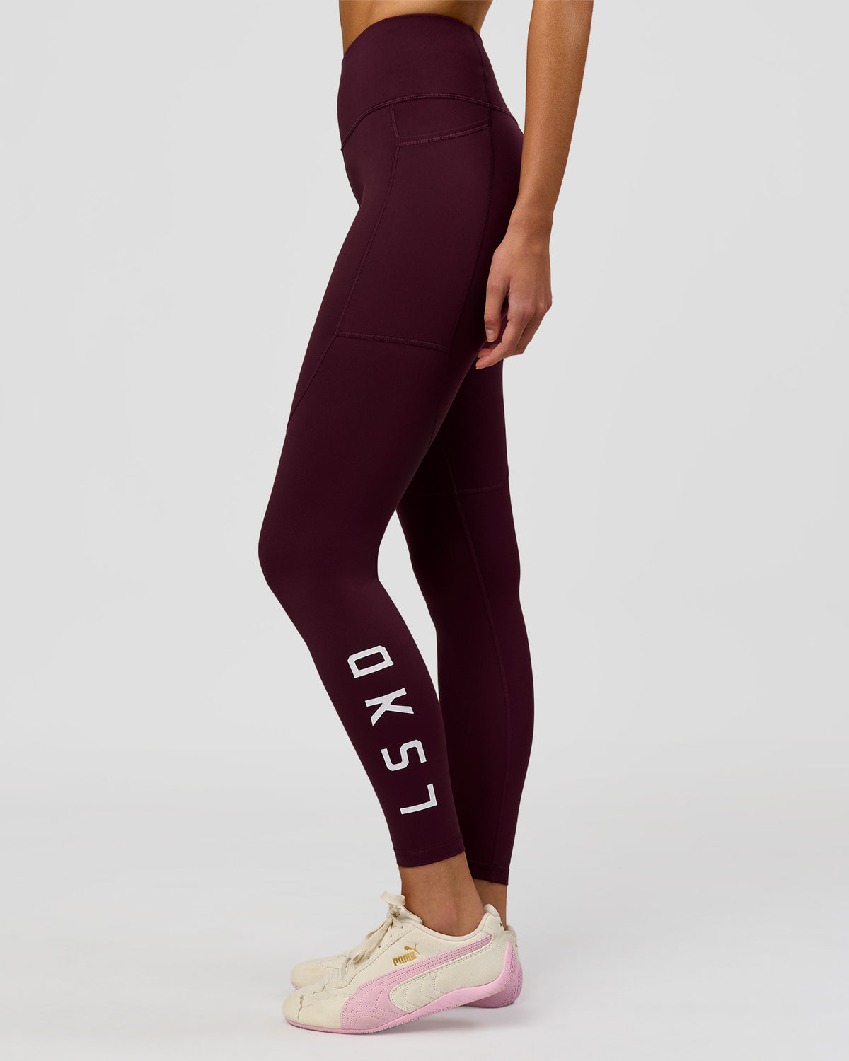 Woman wearing Rep Ultra High-Rise Full Length Legging Pockets - Cherry Lacquer-White | Model:Taneisha | Size:XS