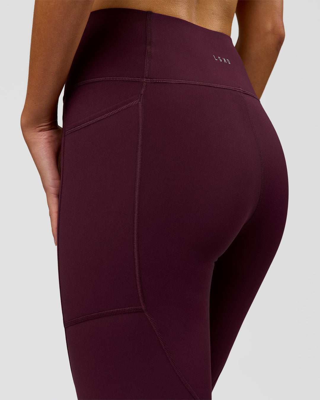 Woman wearing Rep Ultra High-Rise Full Length Legging Pockets - Cherry Lacquer-White | Model:Taneisha | Size:XS - view 7