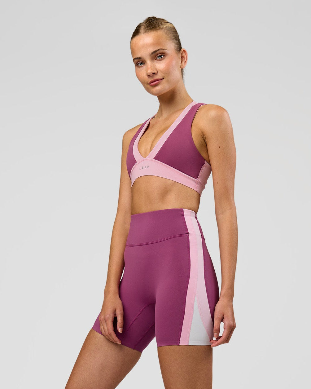 Woman wearing Revitalise Ultra High-Rise 6" Short - Boysenberry-Pink Rose | Model:Taneisha | Size:XS