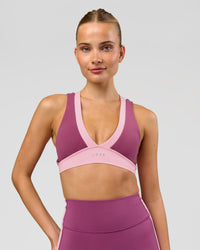 Woman wearing Stamina Layered Sports Bra - Boysenberry-Pink Rose | Model:Taneisha | Size:XS | Thumbnail Index: 3
