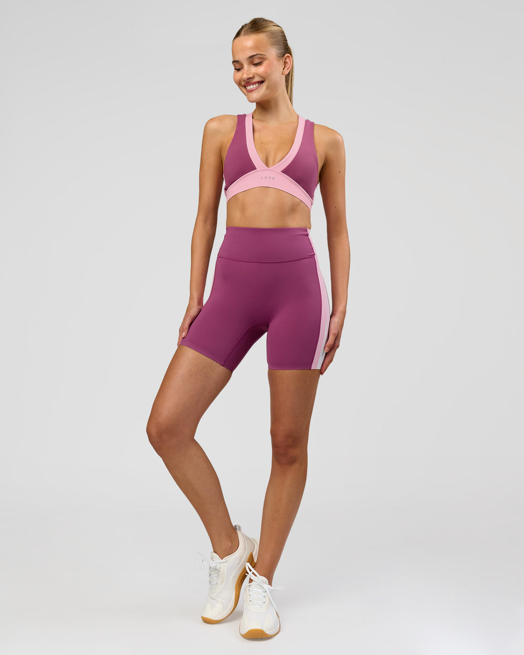 Woman wearing Stamina Layered Sports Bra - Boysenberry-Pink Rose | Model:Taneisha | Size:XS - view 7