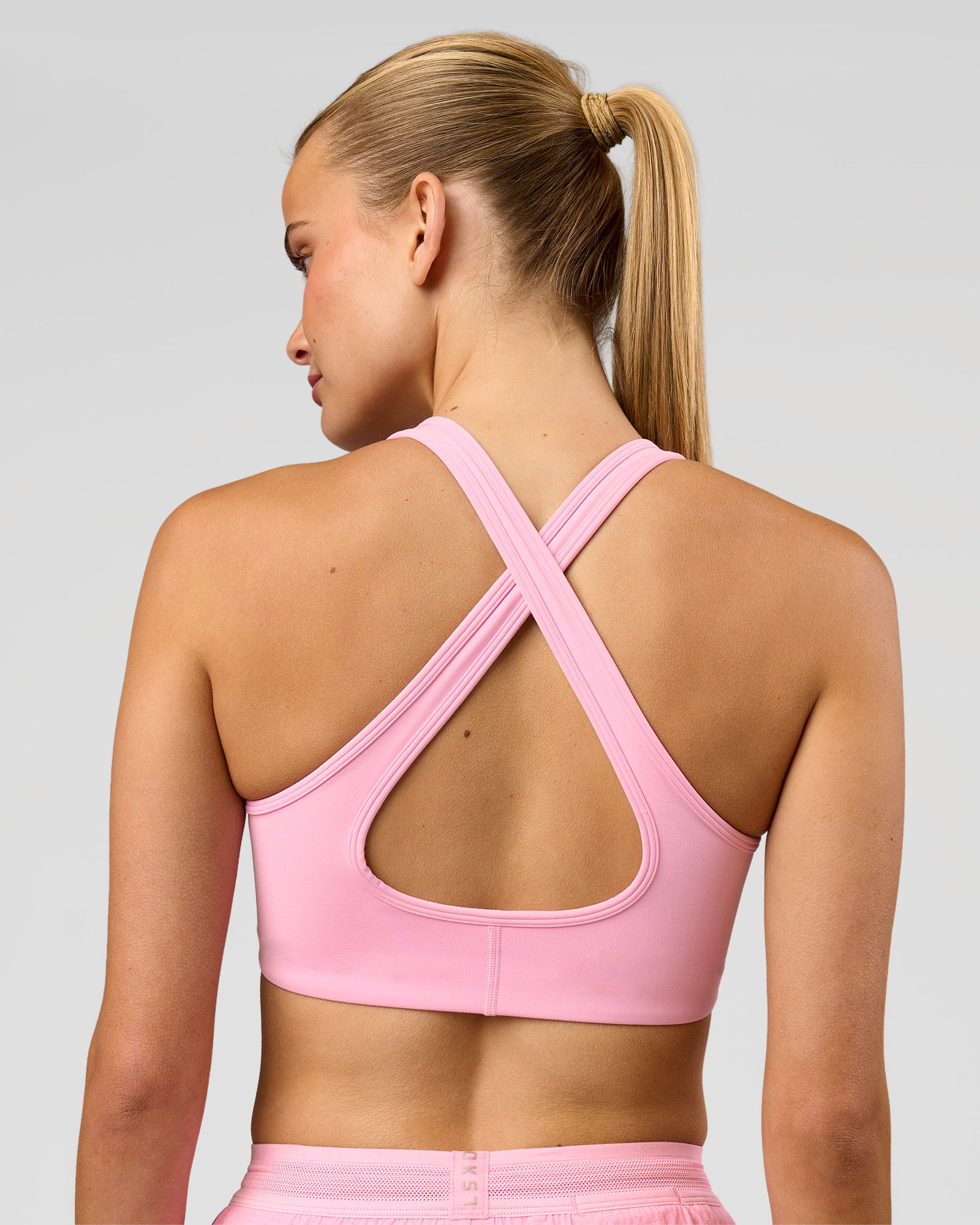 Woman wearing Stamina Sports Bra - Pink Rose | Model:Taneisha | Size:XS