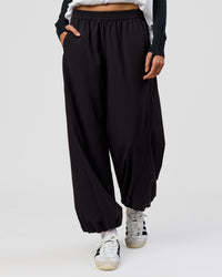 Woman wearing Stitch Up Track Pant - Black | Model:Taneisha | Size:XS | Thumbnail Index: 1