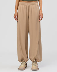 Woman wearing Stitch Up Track Pant - Warm Smoke | Model:Taneisha | Size:XS | Thumbnail Index: 2