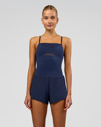 Woman wearing Tia-Clair Toomey-Orr Legacy 3" Run One-Piece - Future Navy | Model:Taneisha | Size:XS | Thumbnail Index: 1