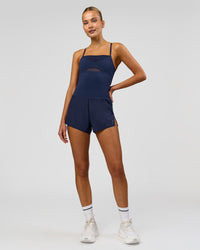Woman wearing Tia-Clair Toomey-Orr Legacy 3" Run One-Piece - Future Navy | Model:Taneisha | Size:XS | Thumbnail Index: 6