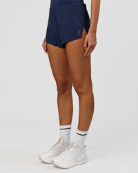 Woman wearing Tia-Clair Toomey-Orr Legacy 3" Run One-Piece - Future Navy | Model:Taneisha | Size:XS | Thumbnail Index: 10