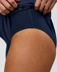 Woman wearing Tia-Clair Toomey-Orr Legacy 3" Run One-Piece - Future Navy | Model:Taneisha | Size:XS | Thumbnail Index: 14