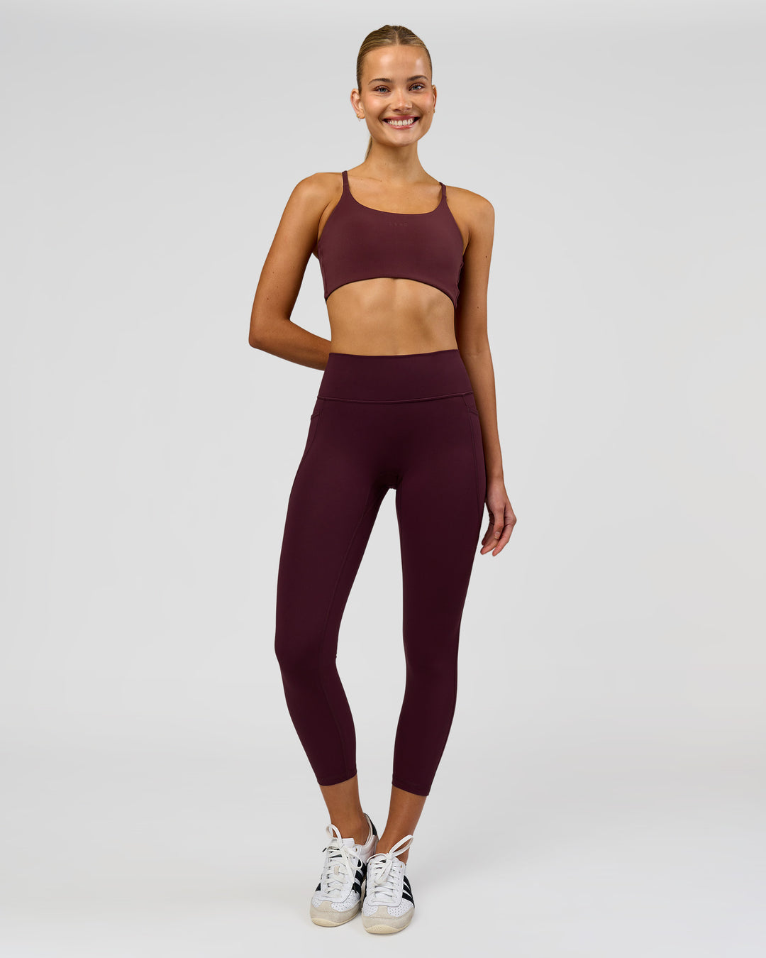 Woman wearing Twist Sports Bra - Cherry Lacquer | Model:Taneisha | Size:XS - view 3