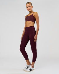 Woman wearing Twist Sports Bra - Cherry Lacquer | Model:Taneisha | Size:XS | Thumbnail Index: 4