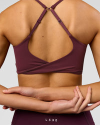 Woman wearing Twist Sports Bra - Cherry Lacquer | Model:Taneisha | Size:XS | Thumbnail Index: 5