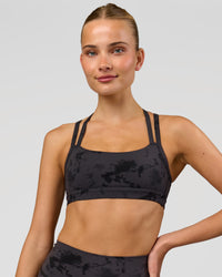 Woman wearing Velocity Sports Bra - Black Tie Dye | Model:Taneisha | Size:XS | Thumbnail Index: 3