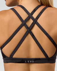 Woman wearing Velocity Sports Bra - Black Tie Dye | Model:Taneisha | Size:XS | Thumbnail Index: 4