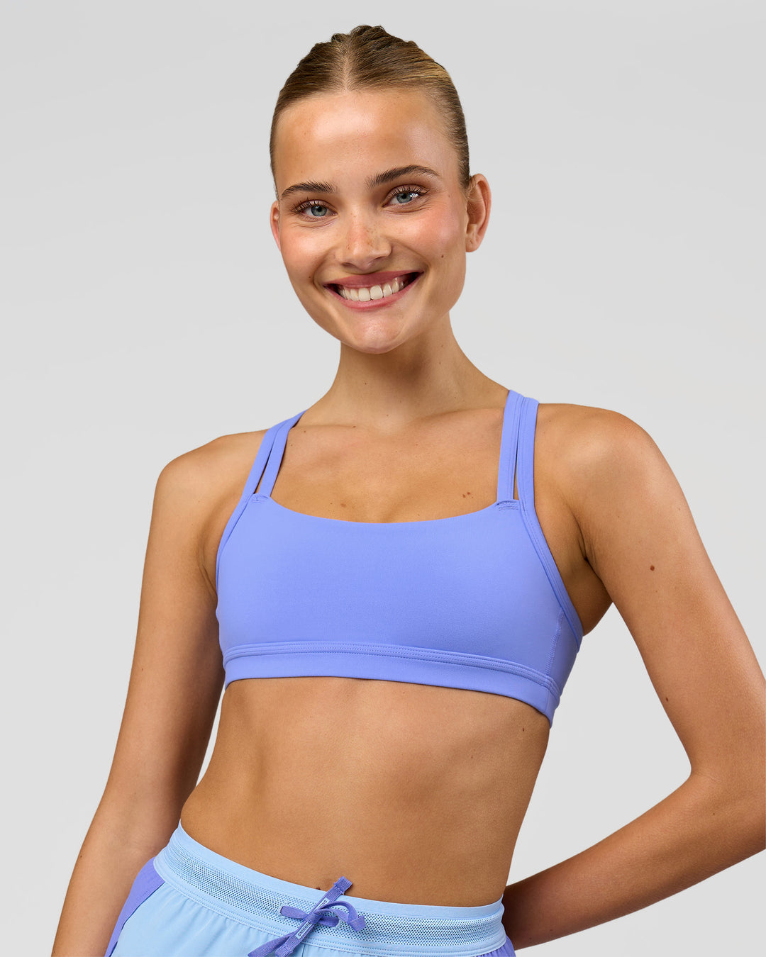 Woman wearing Velocity Sports Bra - Bluebell | Model:Taneisha | Size:XS - view 5