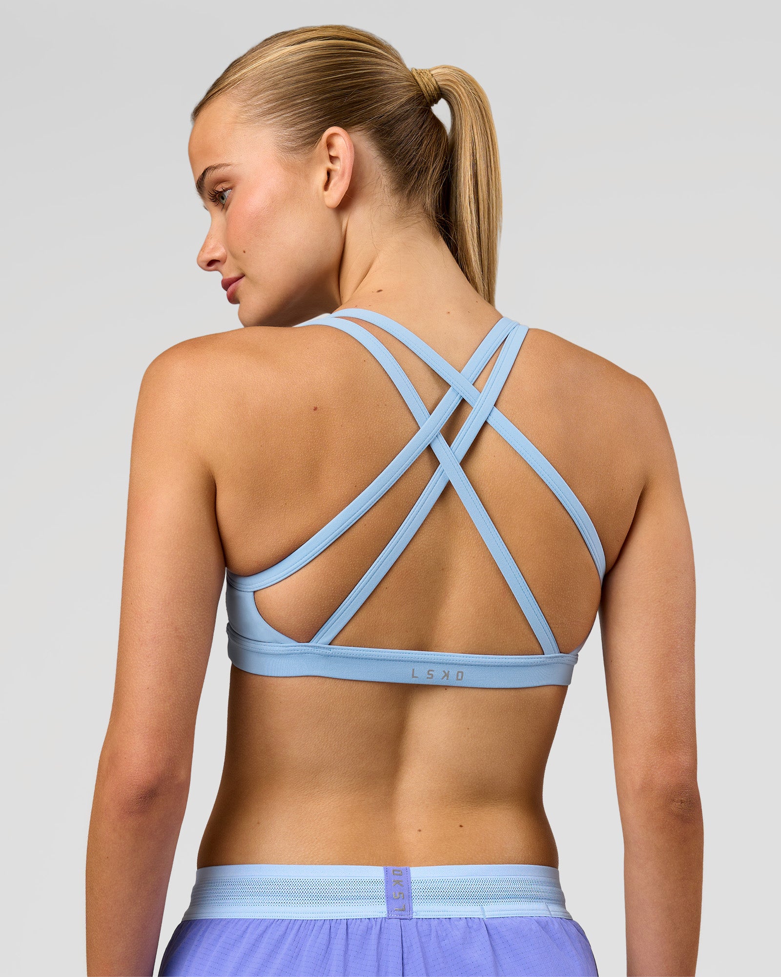 Woman wearing Velocity Sports Bra - Open Air | Model:Taneisha | Size:XS